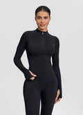 Haut ajusté sans coutures en tricot sergé avec demi-fermeture éclair et trous pour les pouces, coupe longue