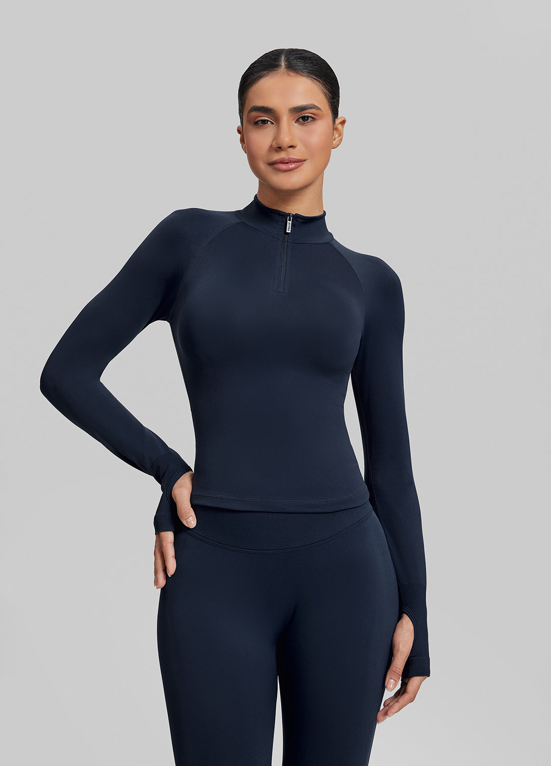 Haut en maille sergée à demi-zip, sans coutures, ajusté, long et avec trous pour les pouces