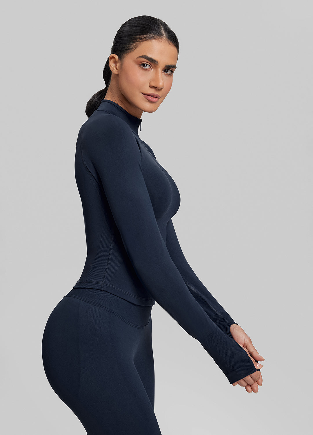 Haut en maille sergée à demi-zip, sans coutures, ajusté, long et avec trous pour les pouces