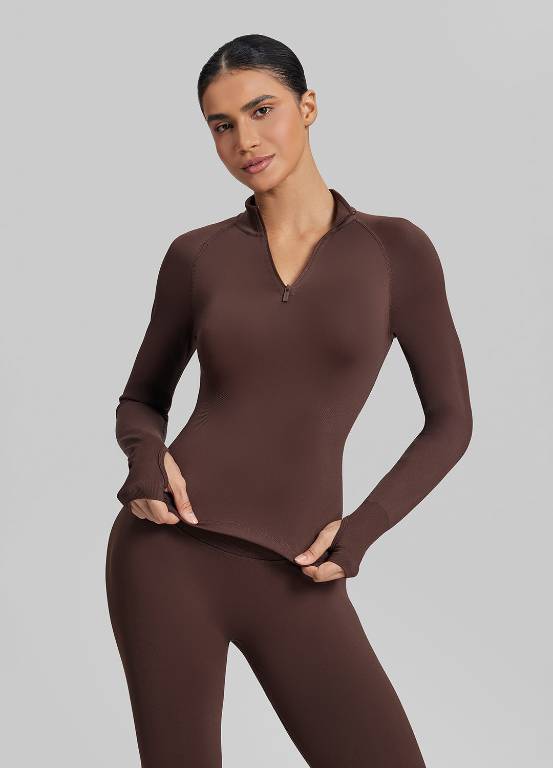 Haut mi-zippé en tricot sergé, sans coutures, moulant, long, avec trous pour les pouces