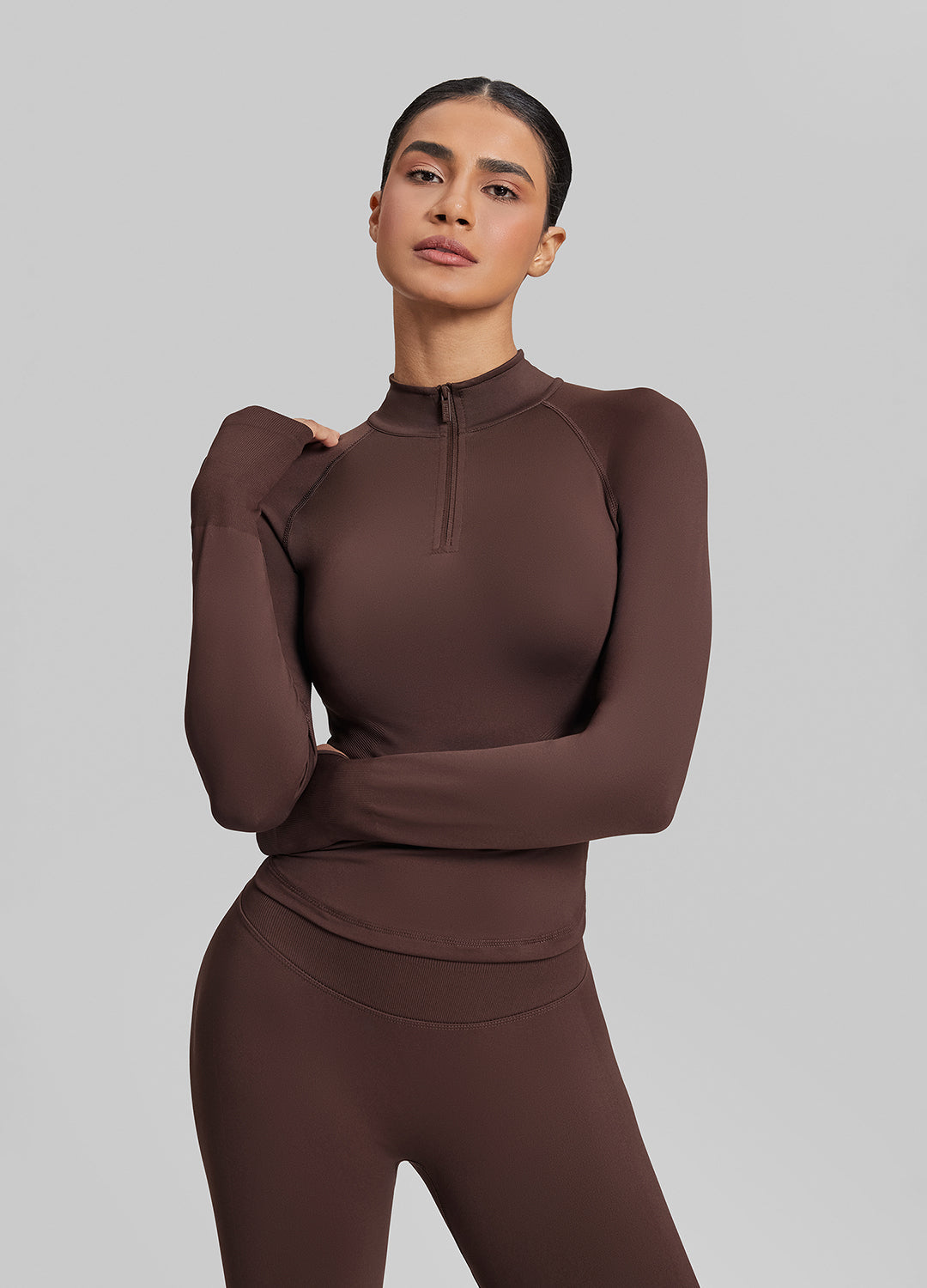 Haut mi-zippé en tricot sergé, sans coutures, moulant, long, avec trous pour les pouces