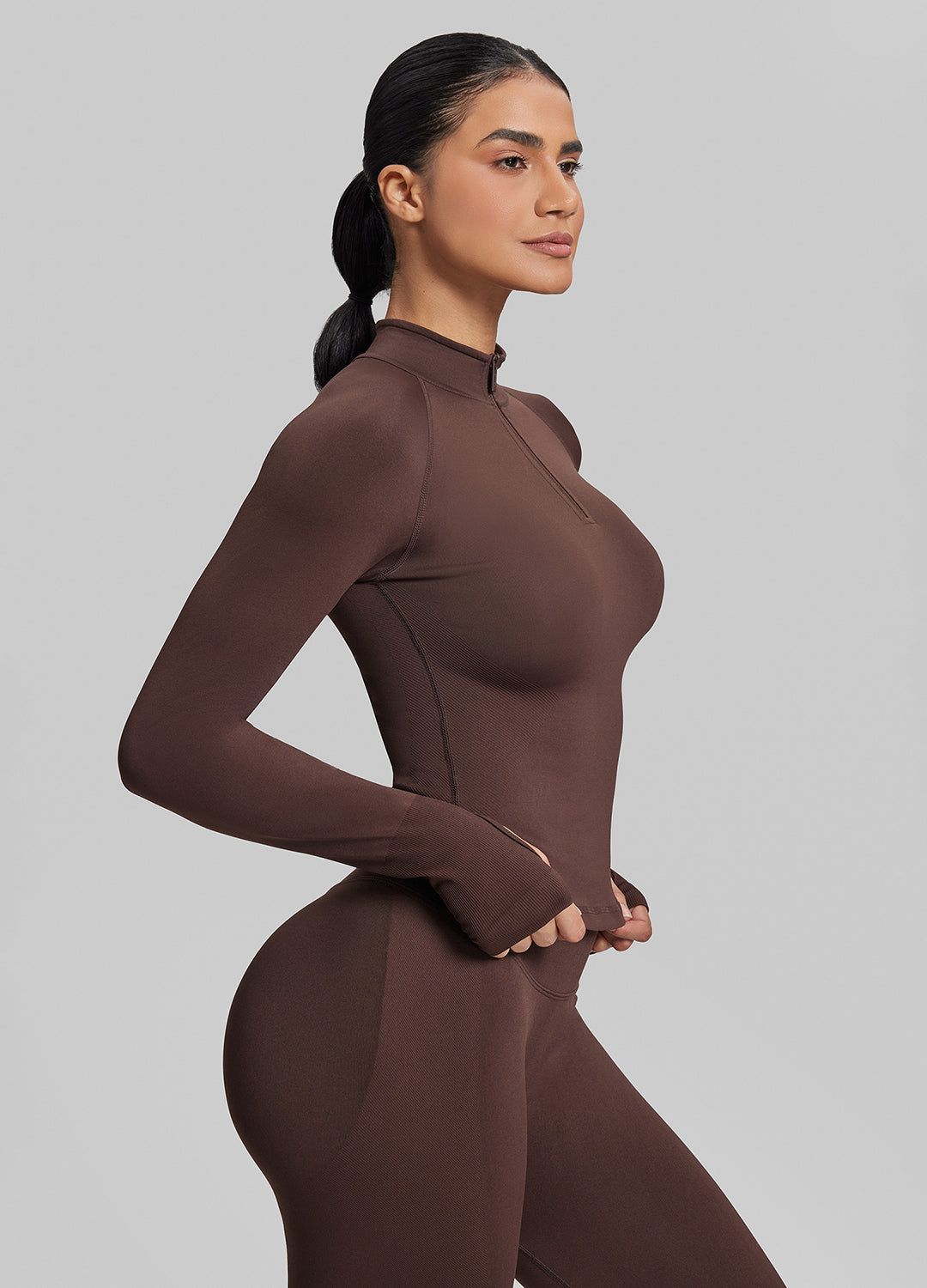Haut mi-zippé en tricot sergé, sans coutures, moulant, long, avec trous pour les pouces