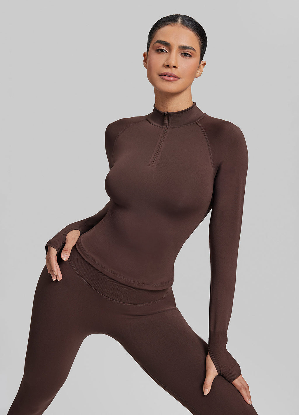 Haut mi-zippé en tricot sergé, sans coutures, moulant, long, avec trous pour les pouces