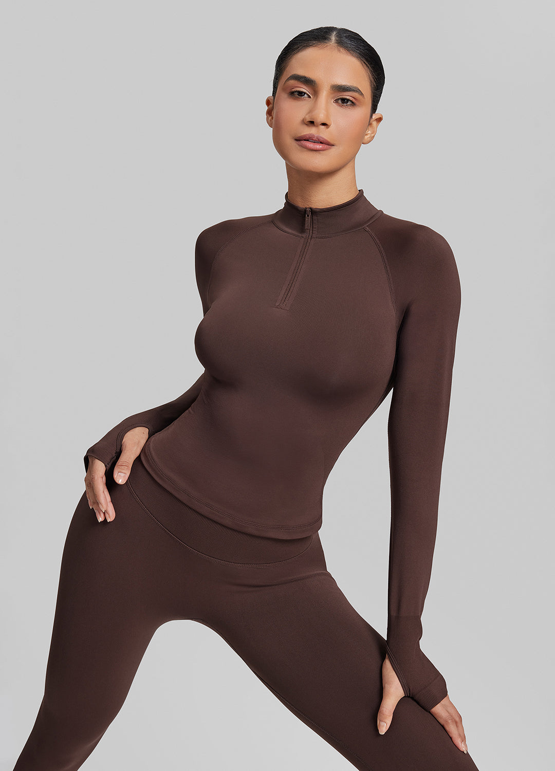 Haut mi-zippé en tricot sergé, sans coutures, moulant, long, avec trous pour les pouces