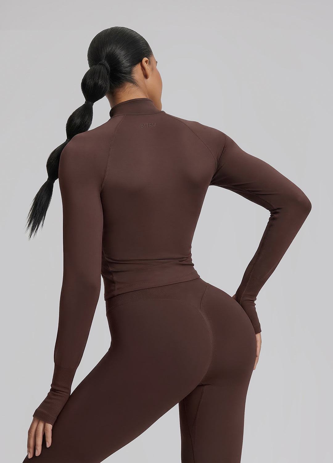 Haut mi-zippé en tricot sergé, sans coutures, moulant, long, avec trous pour les pouces