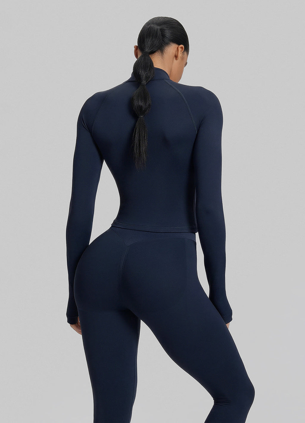 Haut en maille sergée à demi-zip, sans coutures, ajusté, long et avec trous pour les pouces